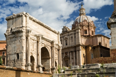 Arch of Septimius Severus and church of Santi Luca e Martina at the Roman Forum, Romeの写真素材