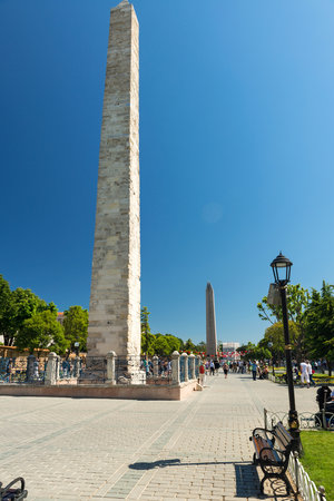 Tourists visiting the ancient Hippodrome on may 26, 2013 in Istanbul, Turkey  The Walled Obelisk  front  and the Obelisk of Thutmosis III  back  are the greatest monuments of Byzantine Culture のeditorial素材