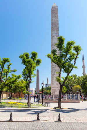 Tourists visiting the ancient Hippodrome on may 26, 2013 in Istanbul, Turkey  The Walled Obelisk  front  was built by the Emperor Constantine Porphyrogenitus in the 10th century のeditorial素材
