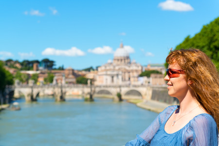Young female tourist on the background of the St  Peter s cathedral in Rome, Italyの写真素材