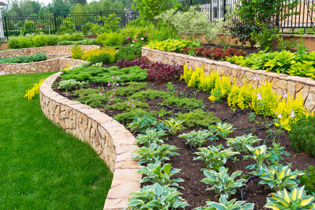 Natural stone landscaping in home gardenの写真素材