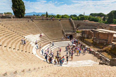 POMPEII, ITALY - MAY 13: Tourists visit the ruins of the amphitheater. Pompeii is an ancient Roman city died from the eruption of Mount Vesuvius in 79 AD.のeditorial素材