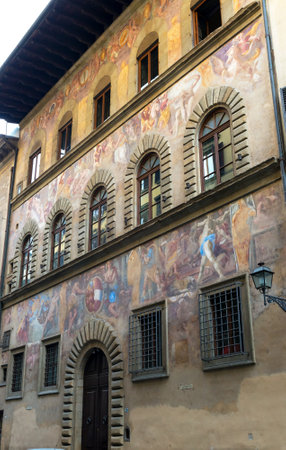 Old house, decorated with frescoes on the street in Florence, Italyのeditorial素材