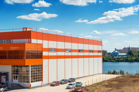 Warehouse on the banks of the river on a background of blue skyのeditorial素材