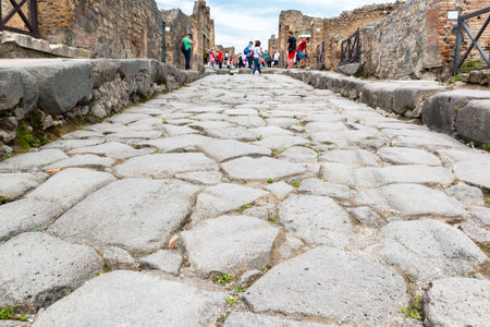 POMPEII, ITALY - MAY 13, 2014: Ancient road in the city. Pompeii is an ancient Roman city died from the eruption of Mount Vesuvius in 79 AD.のeditorial素材