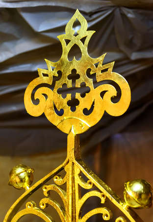 The upper part of the gilded cross on the top of the dome of the Orthodox church during reconstructionの写真素材