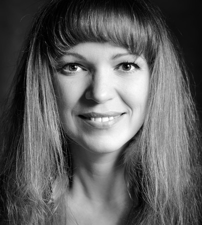 Black and white portrait of a happy young womanの写真素材