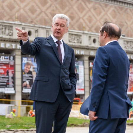 MOSCOW - JUNE 11, 2015: Moscow Mayor S. Sobyanin talks with his deputy on the Triumph Square. This is one of the central squares of Moscow, which conducted large-scale reconstruction.のeditorial素材
