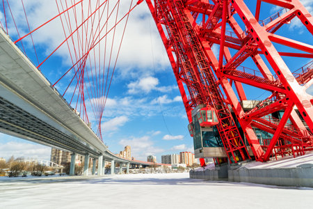 MOSCOW - MARCH 13, 2011: The lift of the modern cable-stayed bridge (Zhivopisny bridge) over the Moskva river. It is the highest cable-stayed bridge in Europe.のeditorial素材