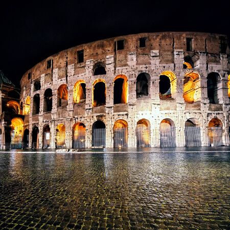 Colosseum (Coliseum) at night in Rome, Italyの写真素材