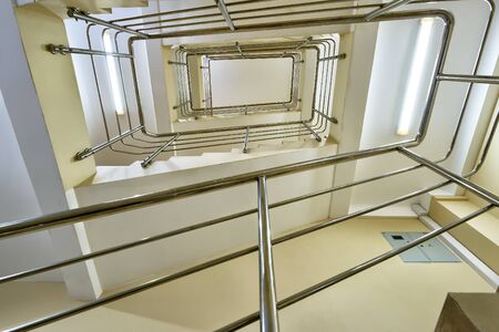 Modern spiral staircase in the officeの写真素材