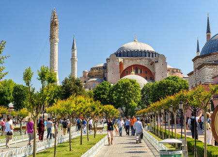 ISTANBUL - MAY 26, 2013: Tourists walk next to Hagia Sophia. Church of Hagia Sophia is the greatest monument of Byzantine Culture and tourist attraction.のeditorial素材