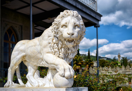 ALUPKA, RUSSIA - MAY 20, 2016: Statue of lion at the Vorontsov Palace facade in the town of Alupka, Crimea. This palace is a tourist attraction of the Crimea.のeditorial素材
