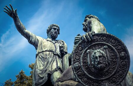 Monument to Minin and Pozharsky next to the Cathedral of Saint Basil and Kremlin on Red Square in Moscow, Russiaの写真素材