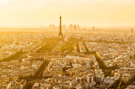 Aerial panoramic view of Paris with the Eiffel tower at sunset. La Defense district in the background.の写真素材