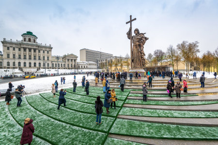 MOSCOW, RUSSIA - NOVEMBER 4, 2016: Monument to Holy Prince Vladimir the Great on Borovitskaya Square near the Kremlin. Vladimir is credited with the introduction of Orthodox Christianity. People visit the monument on the opening day.のeditorial素材