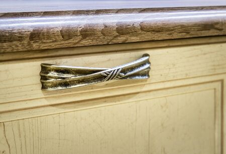 Wooden furniture detail with vintage front and handleの写真素材