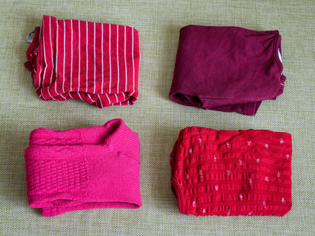 Baby things lie on the couch at homeの写真素材