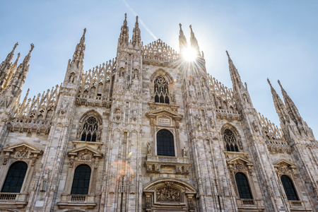 The famous Milan Cathedral (Duomo di Milano) on a sunny day in Milan, Italy. Milan Duomo is the largest church in Italy and the fifth largest in the world.の写真素材