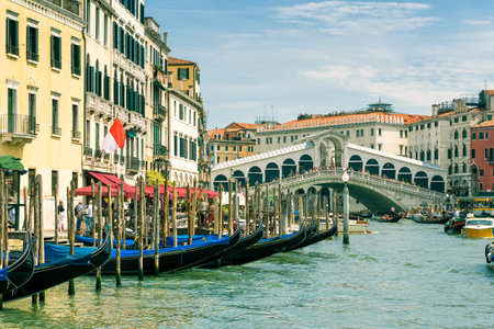 Touristic gondolas on the Grand Canal near the Rialto Bridge in Venice, Italy. Rialto Bridge is one of the main tourist attractions in Venice.のeditorial素材