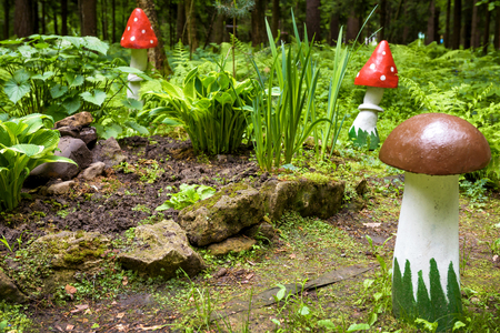 Landscaping with a wooden mushroom in a parkの写真素材
