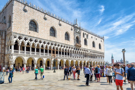 Venice, Italy - May 19, 2017: Doge's Palace, or Palazzo Ducale, on a sunny day. Tourists walk on Piazza San Marco. This is the main tourist destination in Venice.のeditorial素材