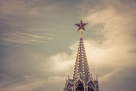 Red star on the spire of the Spasskaya Tower of the Moscow Kremlin, Russia. The Moscow Kremlin is the residence of the Russian president and the main tourist attraction of Moscow.の写真素材