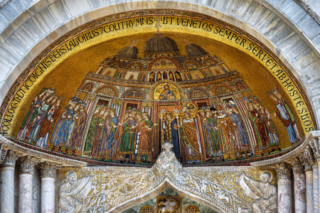 Mosaic of the portal of the Basilica di San Marco (Saint Mark`s Basilica) in Venice, Italy. Basilica di San Marco was built in the 12th century and is the main tourist attraction of Venice.のeditorial素材