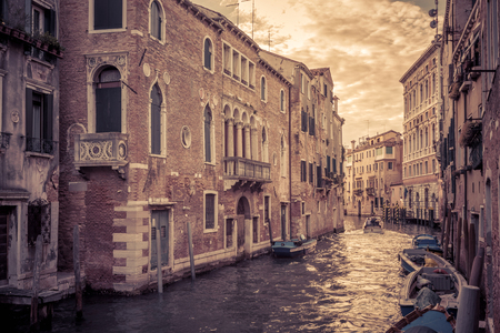 The canal in Venice is a street in the city, Italy. The canal with boats at sunset.の写真素材