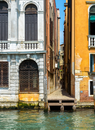 A narrow old street in Venice, Italy. Viiew from the Grand Canal.の写真素材