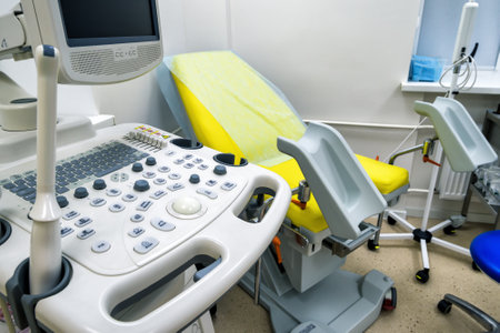 Gynecological cabinet with chair and medical equipment for ultrasonic diagnostics in a clinic room
