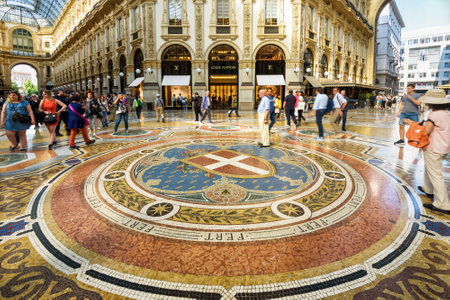 Milan, Italy - May 16, 2017: Tourists are walking in the Galleria Vittorio Emanuele II on the Piazza del Duomo in central Milan. This gallery is one of the world's oldest shopping malls.のeditorial素材