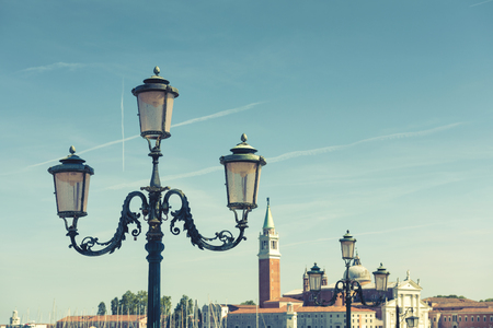 Lantern on the Saint Mark`s Square (Piazza San Marco) in Venice, Italy.  It is the main square of Venice. San Giorgio Maggiore in the background.の写真素材