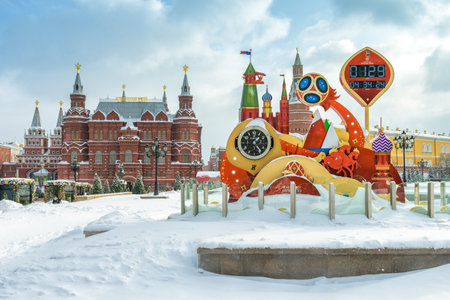 Moscow, Russia - February 5, 2018: FIFA World Cup 2018 countdown clock at the heart of Moscow in winter. Manezhnaya Square during snowfall. State Historical Museum and Moscow Kremlin in background.のeditorial素材