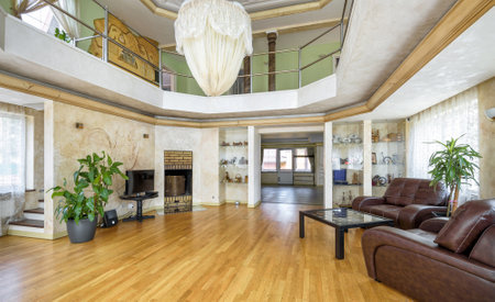 Moscow - May 2, 2018: Modern interior of residential house or hotel. Large hall with couches and plants for relax. Interior of a luxury contemporary home atrium. Interior design in classic style.のeditorial素材