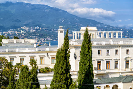 Crimea, Russia - May 17, 2016: Livadia Palace overlooking Yalta city in Crimea. Scenic view of a famous landmark of Crimea on Black Sea coast. Historical architecture and nature of Crimea in summer.のeditorial素材