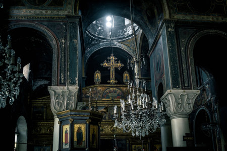 Athens - May 6, 2018: Inside an old Orthodox church in Athens, Greece. Dark vintage interior of the...