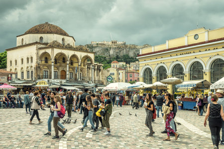 Athens - May 7, 2018: Monastiraki square overlooking Acropolis in Athens, Greece. People visit an old center of Athens in summer. This historical area is one of the main tourist attractions in Athens.のeditorial素材