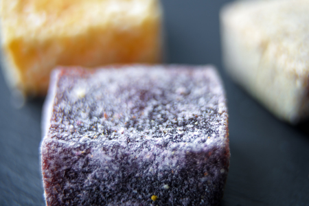 Arab sweets on dark background. Middle eastern dessert food from natural fruits. Turkish delight candies close-up. Macro view of oriental eco sweets.の写真素材