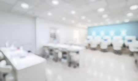 Nail salon interior as creative abstract blur background. Panoramic view of a modern manicure salon....