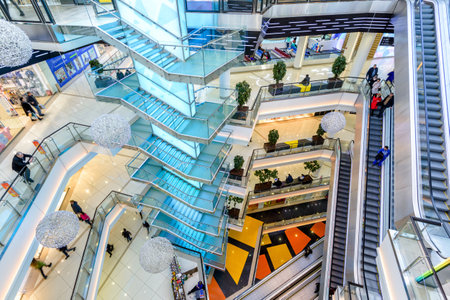 Moscow - March 9, 2017: Interior of luxury mall, top view. Panorama of a large shop or store with stairs and escalators. Inside the modern shopping center. Concept of shop and retail.のeditorial素材