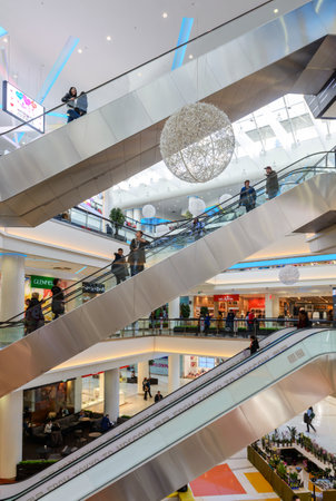 Moscow - March 9, 2017: Interior of luxury mall. Escalators in a large shop or store. People inside the shopping center. Concept of shop and retail.のeditorial素材