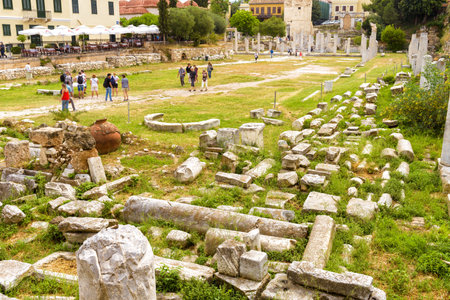 Athens â May 6, 2018: People visit the Roman Agora in Athens, Greece. It is one of the main landmarks of Athens. Panorama of Ancient Greek ruins near Plaka district. Scenery of old Athens in summer.のeditorial素材