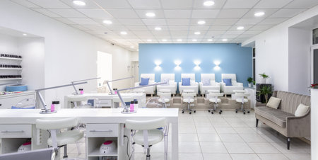 Moscow â Feb 7, 2019: Nail salon bright interior. Panoramic view of a modern manicure salon. Inside a beauty studio with white design.のeditorial素材
