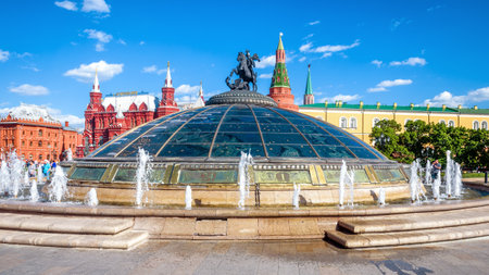 Moscow - May 19, 2019: Manezhnaya Square in Moscow, Russia. Modern glass dome with fountains and St George statue overlooking the Moscow Kremlin. Panoramic view of the Moscow city center in summer.のeditorial素材