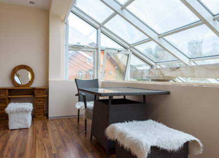 Moscow - May 2, 2018: Interior of hotel or residential house in daylight. Cozy room with furniture in mansard or attic. Modern home interior with panoramic window.のeditorial素材