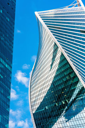 Moscow - Sep 10, 2017: Modern buildings in Moscow-City, Russia. Evolution Tower with futuristic twisted design. Moscow-City is district with business and residential skyscrapers. Urban architecture.のeditorial素材
