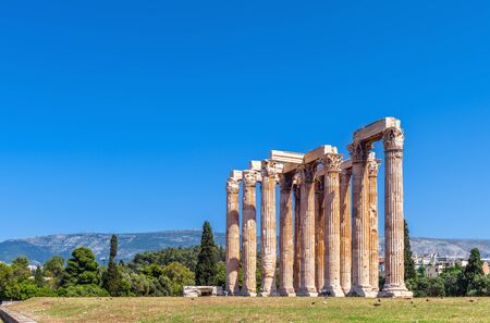 Temple of Olympian Zeus, Athens, Greece. It is a famous landmark of Athens. Panorama of Ancient Greek ruins in the Athens center. Scenic view of the great remains of old city against sky background.の写真素材