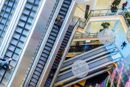 Moscow - March 9, 2017: Interior of luxury mall. Top view of large shop or store with stairs, escalators and travelators. Inside the modern shopping center. Concept of retail industry and technology.のeditorial素材