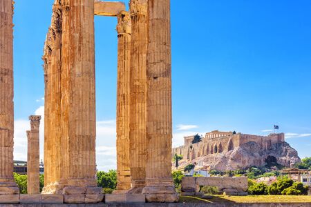 Olympian Zeus temple in summer, Athens, Greece. It is one of top landmarks of Athens. Great columns of the famous Zeus house overlooking Acropolis of Athens. View of majestic Ancient Greek ruins.の写真素材